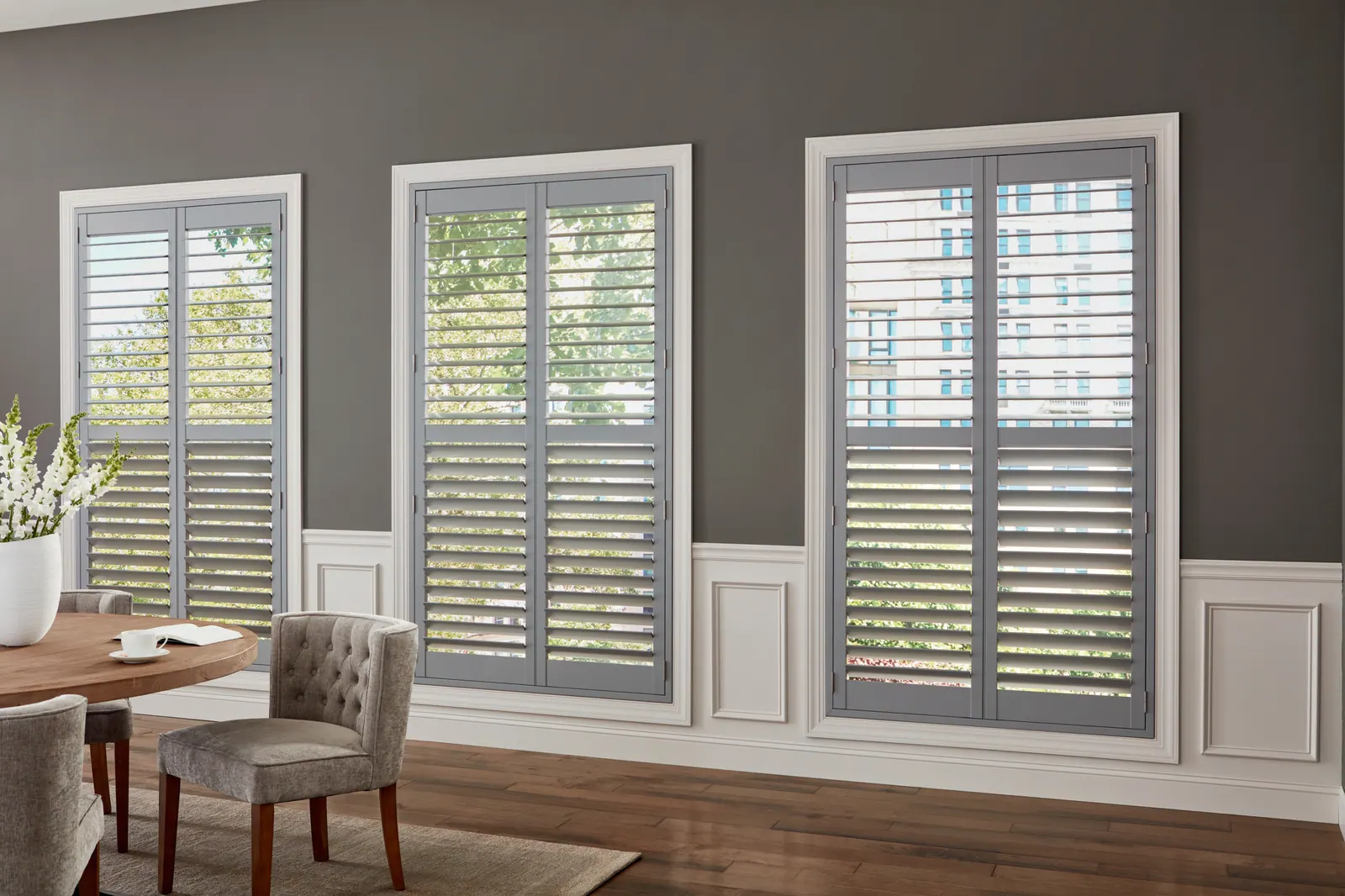 White plantation shutters with soft-close hinges in a Colorado Springs dining room