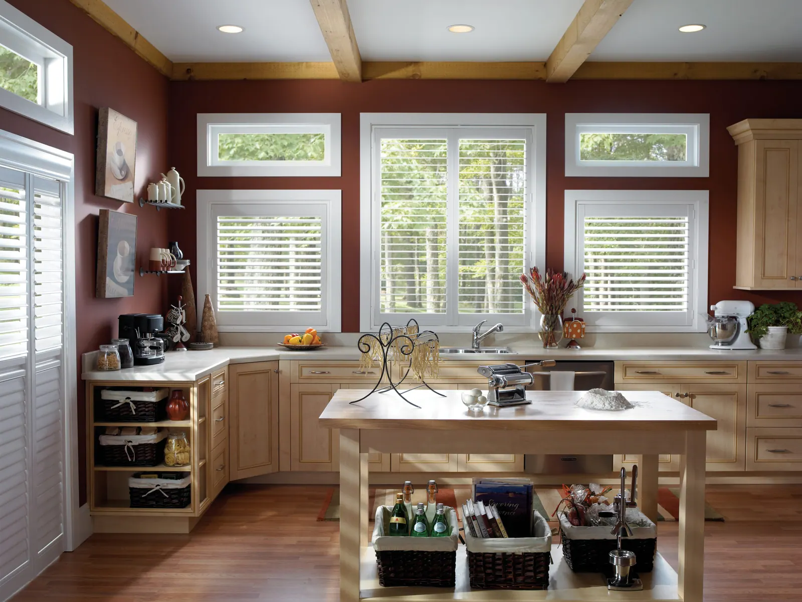 Full-height white plantation shutters in a bright living room